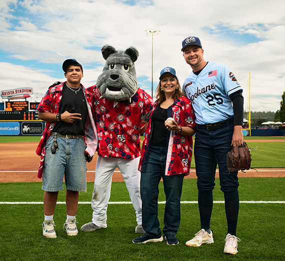 President McCulloh giving a speech with sparkling lights in the background.